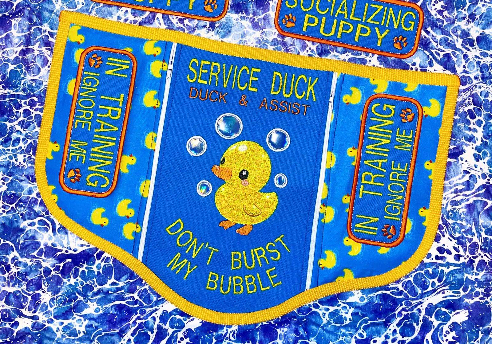 Blue rubber-duck three-panel convertible embroidered Service Duck, Duck & Assist, Don't burst my bubble, with In Training side patches.